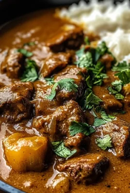 Slow-Cooked Beef Curry in Coconut Gravy with Toasted Garlic Naan